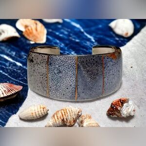 Vintage blue sponge coral inlay bi metal cuff bracelet. 
Bracelet measures 2 1/4